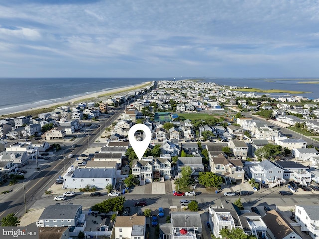 bird's eye view with a residential view and a water view