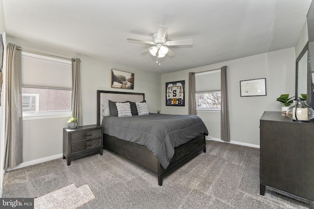 carpeted bedroom with a ceiling fan and baseboards