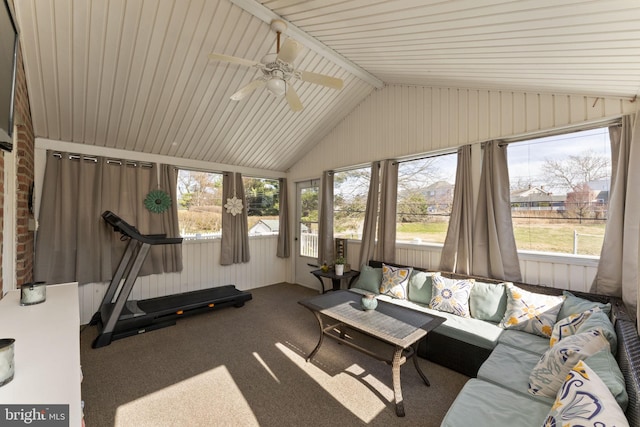 sunroom featuring outdoor lounge area, a ceiling fan, vaulted ceiling, and carpet