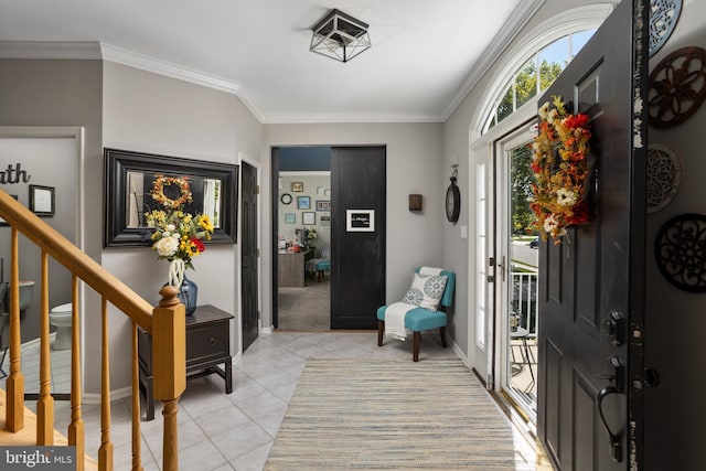 foyer featuring stairs, baseboards, ornamental molding, and light tile patterned flooring