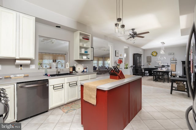 kitchen with dishwasher, light countertops, a ceiling fan, and a sink