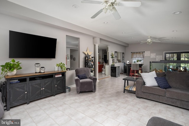 living area featuring lofted ceiling, recessed lighting, a ceiling fan, and ornate columns