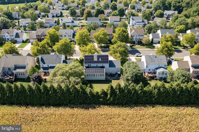 birds eye view of property with a residential view