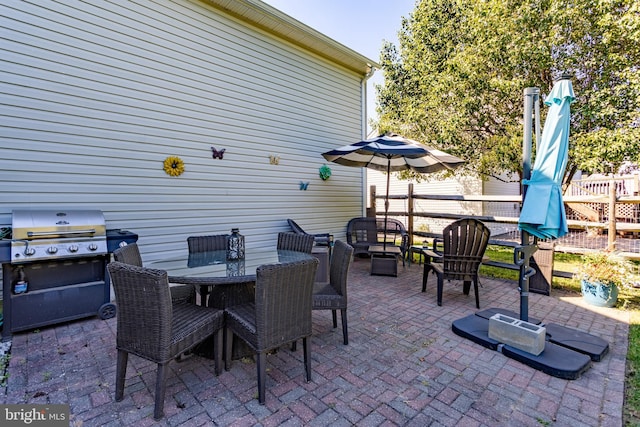 view of patio / terrace with a grill and outdoor dining area