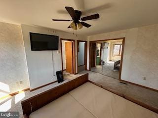 interior space featuring ceiling fan