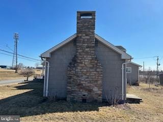 view of side of home featuring a chimney