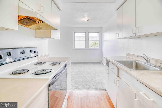 kitchen featuring light countertops, white cabinets, under cabinet range hood, white electric range, and a sink