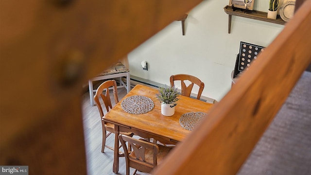 dining space featuring wood finished floors