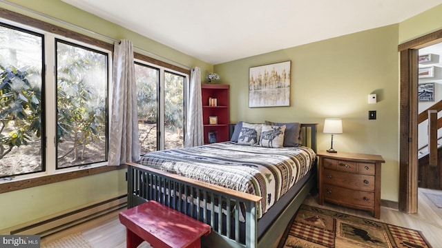 bedroom with a baseboard radiator