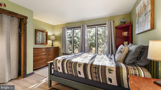 bedroom with light wood-type flooring