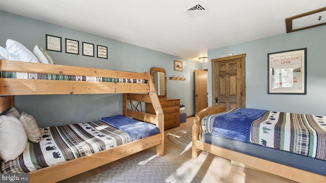 bedroom featuring visible vents