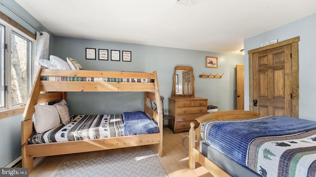 bedroom with wood finished floors