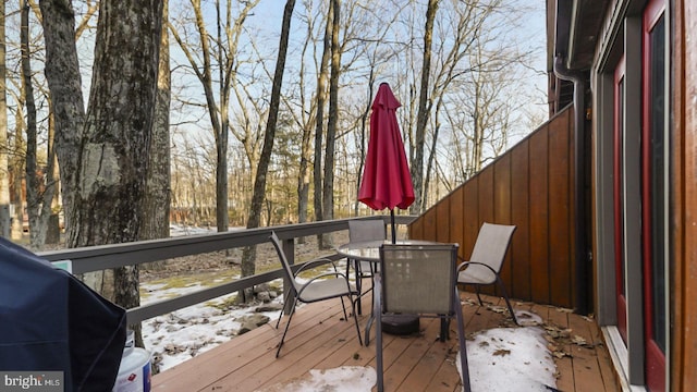 wooden deck featuring outdoor dining area