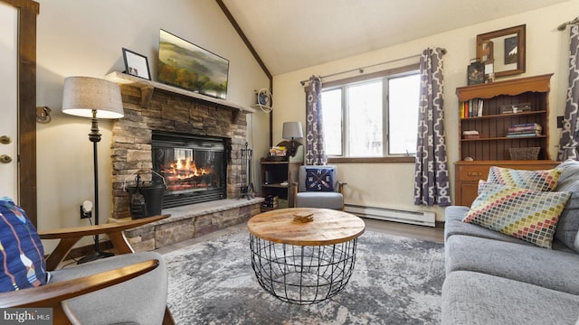 living room featuring a baseboard radiator, a stone fireplace, wood finished floors, and vaulted ceiling