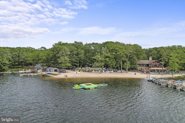 property view of water featuring a forest view