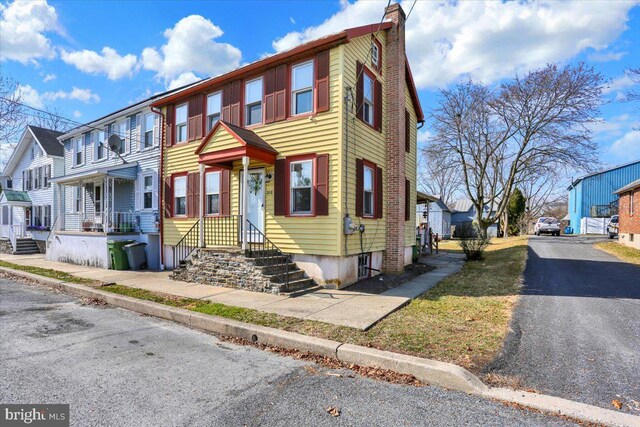 multi unit property featuring a residential view and a chimney