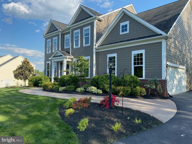 view of front of home with a front yard and brick siding