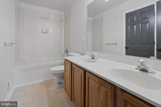 full bathroom featuring double vanity, toilet,  shower combination, and a sink