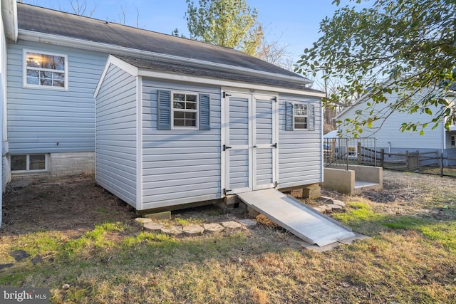 view of shed with fence