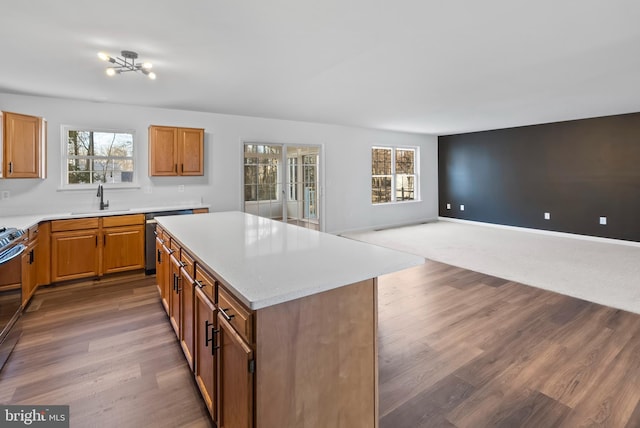 kitchen with plenty of natural light, a center island, and light countertops