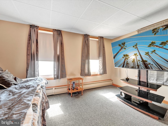 bedroom featuring a paneled ceiling and a baseboard radiator