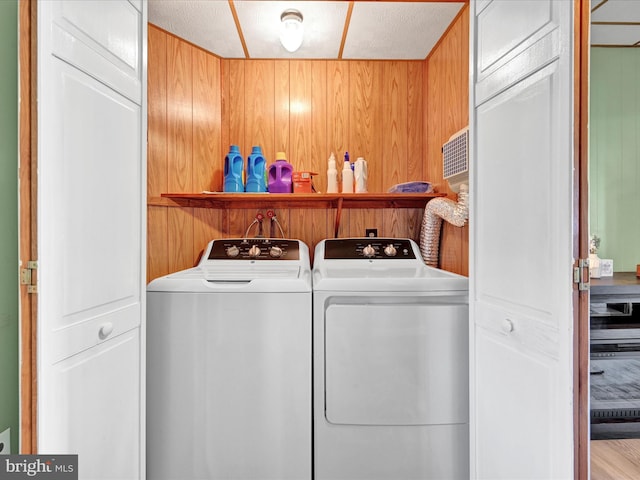 washroom with washer and clothes dryer and laundry area