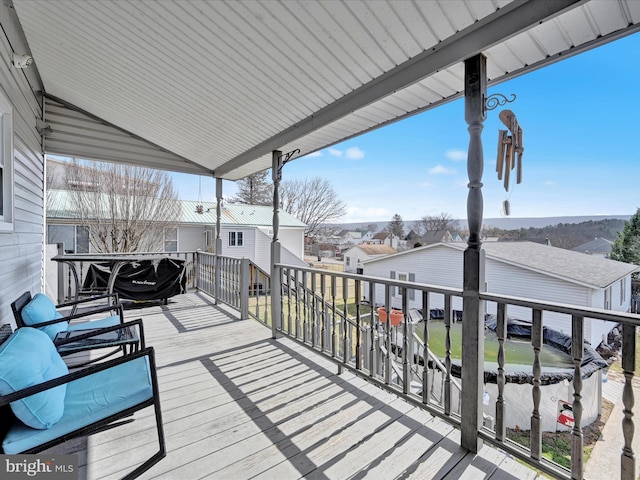 wooden terrace with a residential view