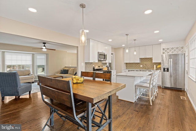 dining room featuring recessed lighting, visible vents, a ceiling fan, and dark wood-style flooring