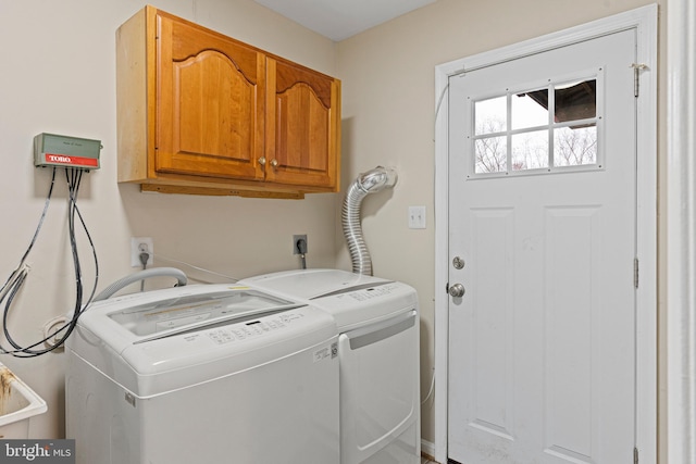 laundry area featuring cabinet space and washing machine and dryer