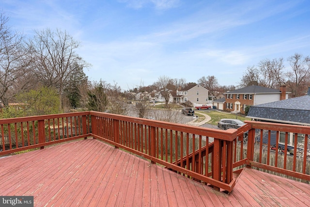 wooden deck with a residential view