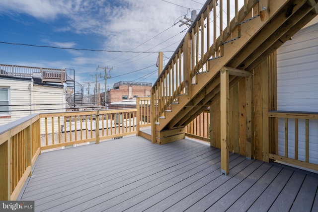 wooden deck featuring stairs