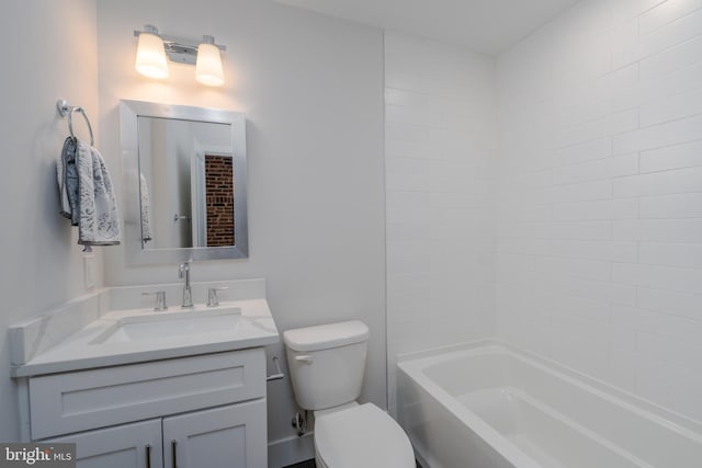 bathroom with toilet, vanity, and bathtub / shower combination