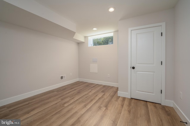 basement featuring visible vents, recessed lighting, baseboards, and light wood-style floors