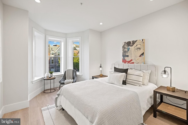 bedroom with light wood-style flooring, recessed lighting, and baseboards