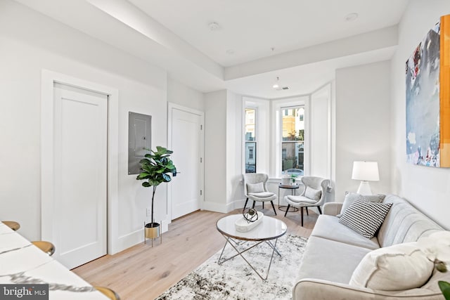 living room with visible vents, recessed lighting, baseboards, and light wood-style floors