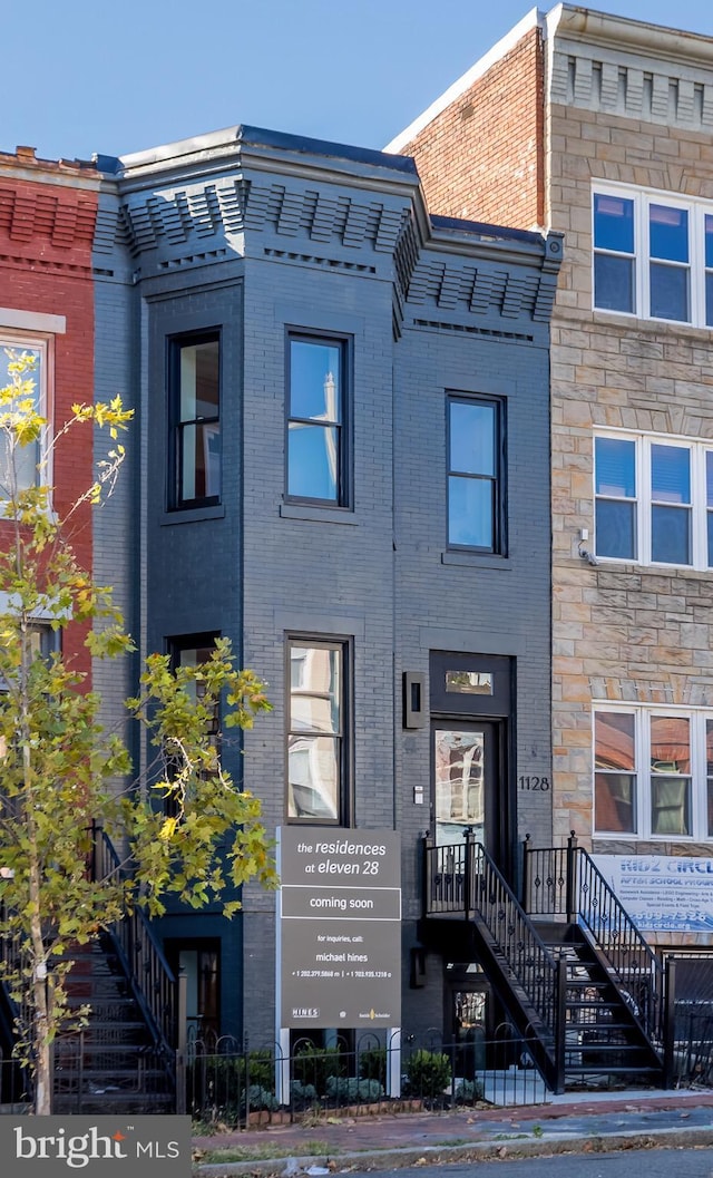 view of property featuring brick siding