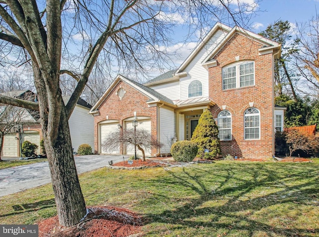 traditional home with a garage, brick siding, and driveway