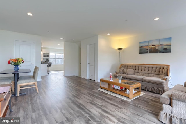 living room featuring recessed lighting and wood finished floors