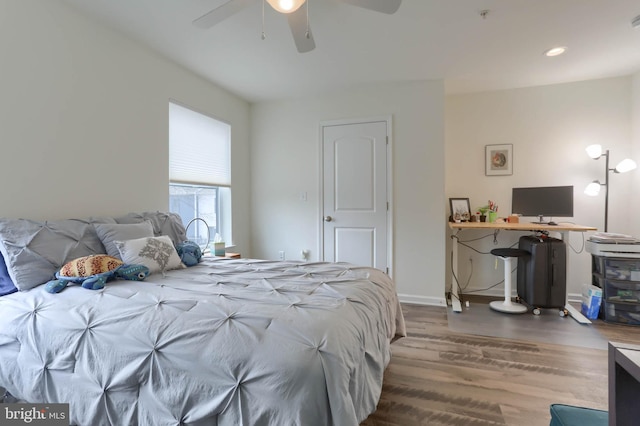 bedroom featuring recessed lighting, baseboards, wood finished floors, and a ceiling fan