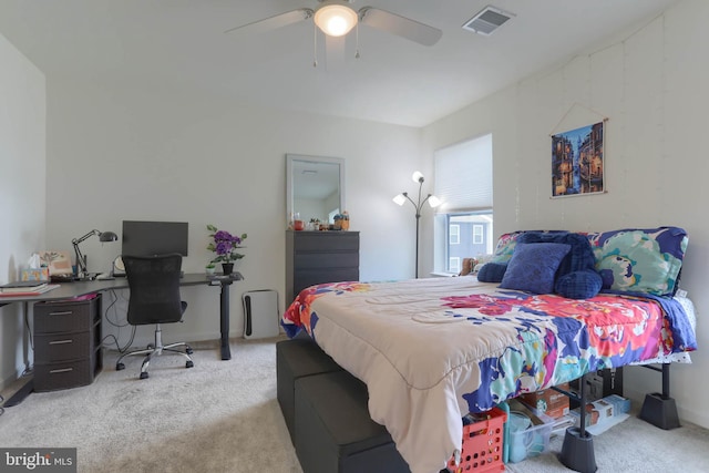 bedroom with a ceiling fan, visible vents, and carpet floors