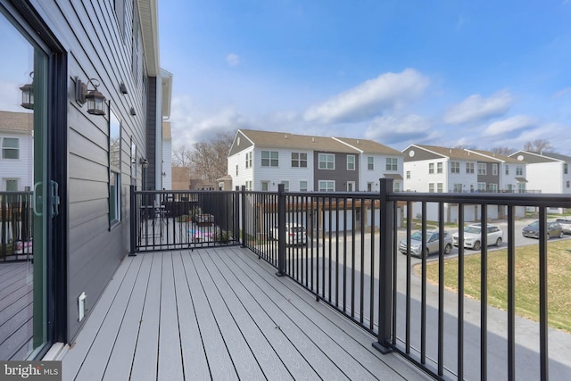 wooden terrace with a residential view