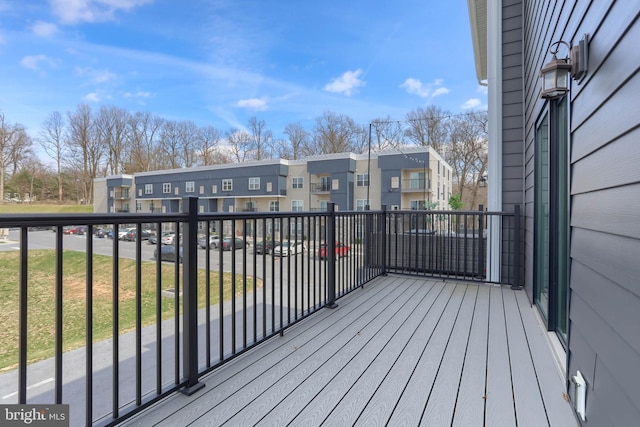 wooden deck with a residential view