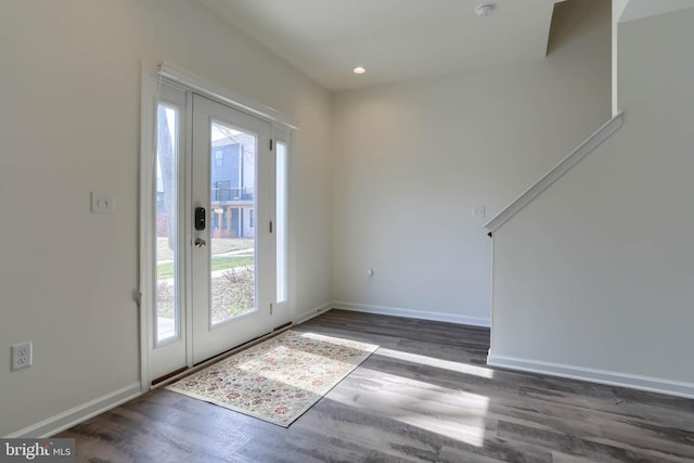 doorway to outside with recessed lighting, baseboards, and wood finished floors