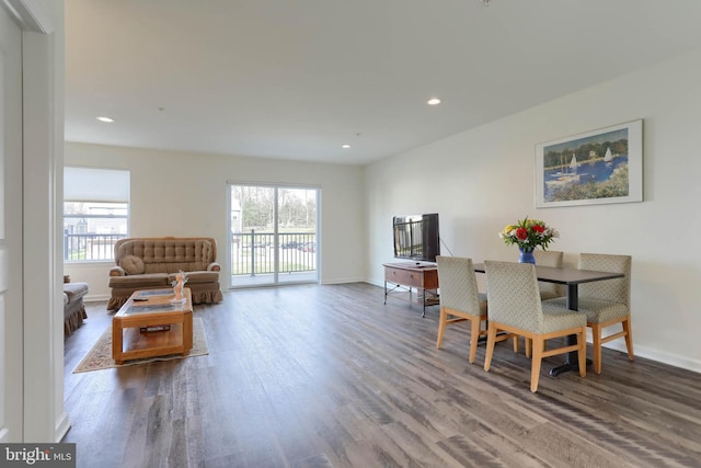 interior space featuring recessed lighting, baseboards, and wood finished floors