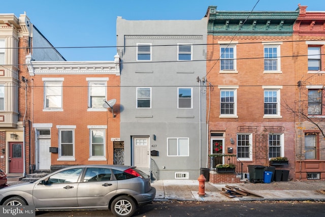 view of property with brick siding