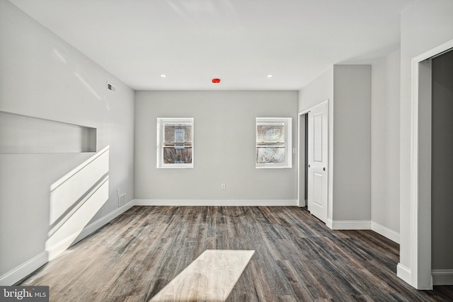 unfurnished room featuring visible vents, recessed lighting, baseboards, and wood finished floors