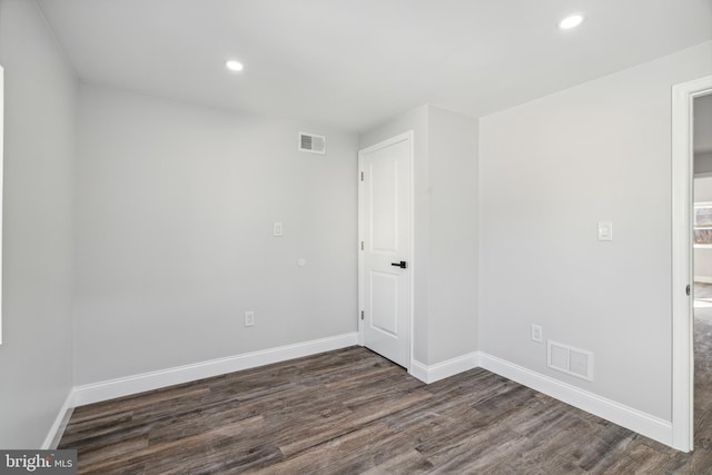 unfurnished room featuring visible vents, recessed lighting, baseboards, and wood finished floors