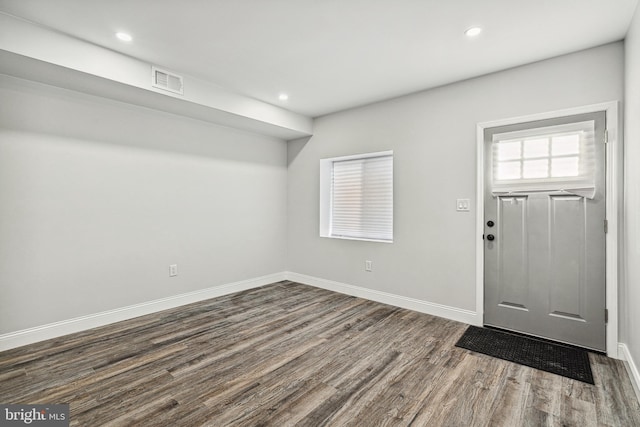 foyer entrance featuring recessed lighting, visible vents, baseboards, and dark wood finished floors