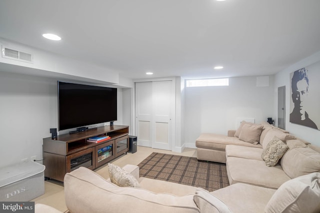 living room featuring visible vents and recessed lighting