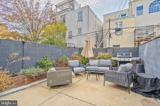 view of patio / terrace featuring area for grilling, a fenced backyard, and outdoor lounge area